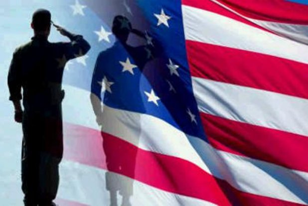 Soldier saluting flag